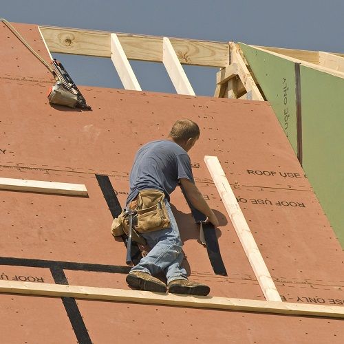construction site workers on a roof
